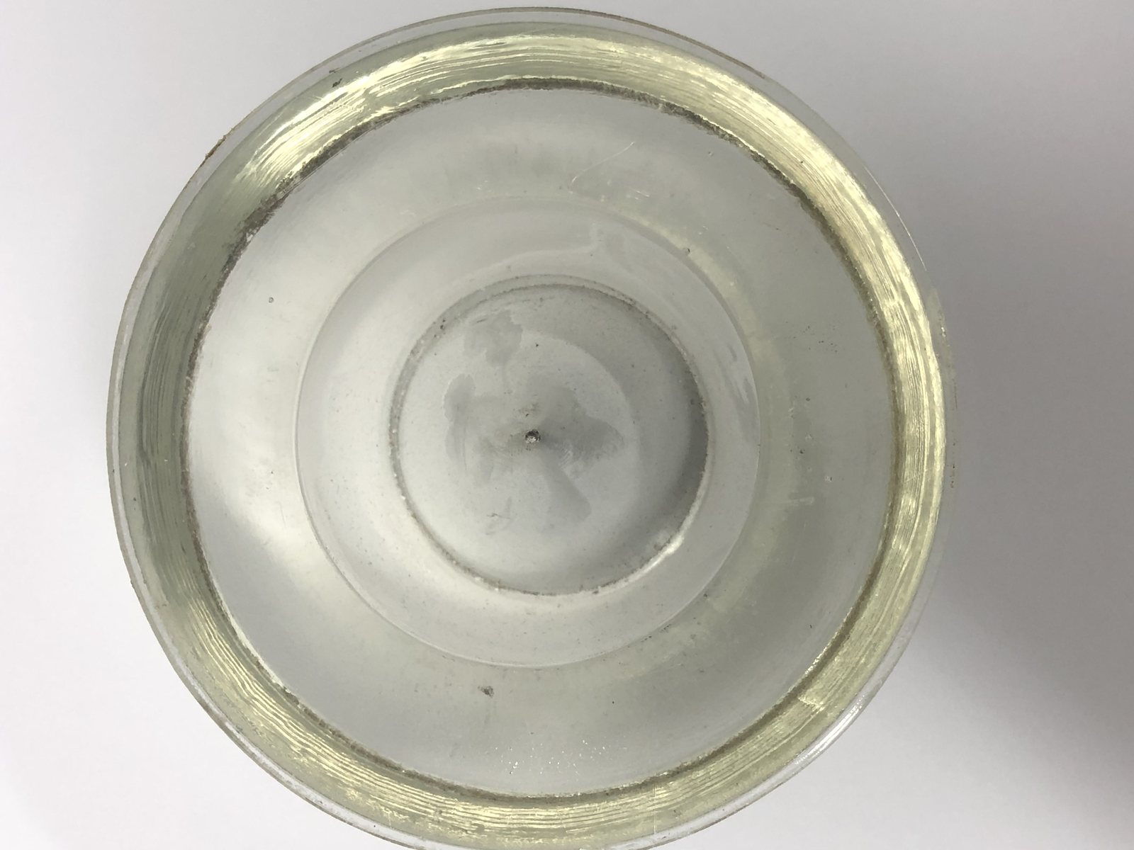 Airfield light lens after one twenty minute ultrasonic cycle, centre optic clear to the glass
