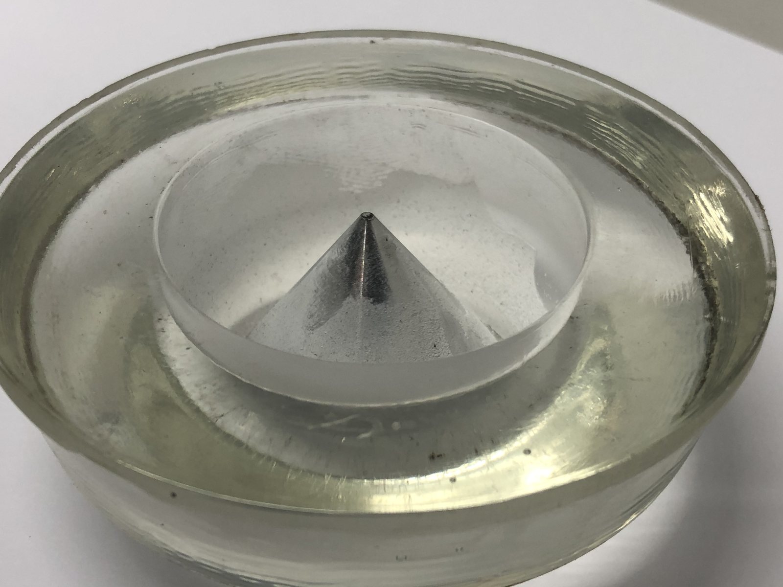 Larger airfield fixture lens with deposit bonded around the cone optic