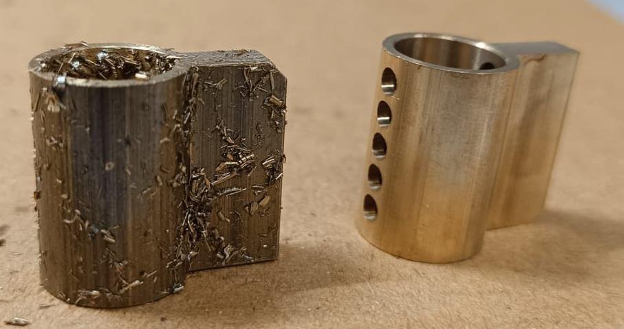 Lock housing pair — swarf-packed as machined, and clear after the cycle.