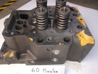 Cat cylinder head complete with valves and springs after sixty minutes