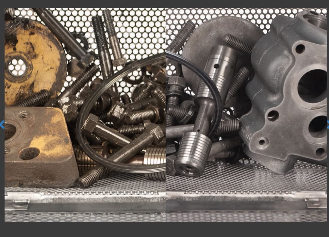 Cylinder head components loaded in a stainless basket in the machine