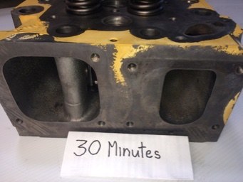 Cat cylinder head ports after thirty minutes, deposit thinning