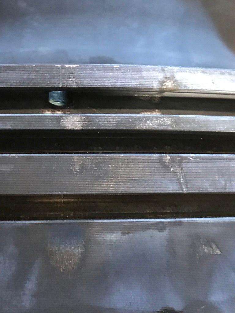 Heavily coked diesel piston before ultrasonic cleaning