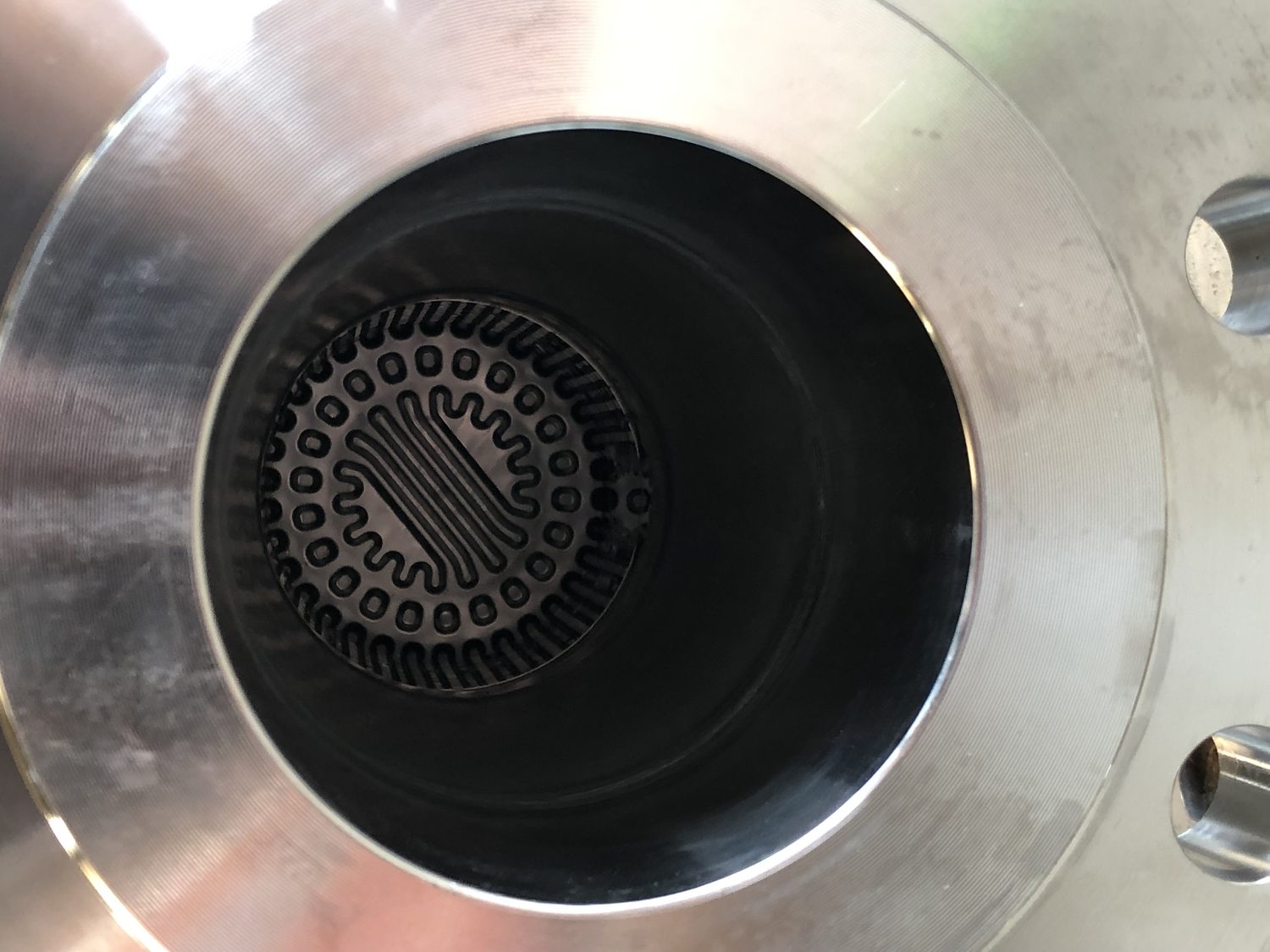 The same heat exchanger tube ends open and clean after ultrasonic immersion