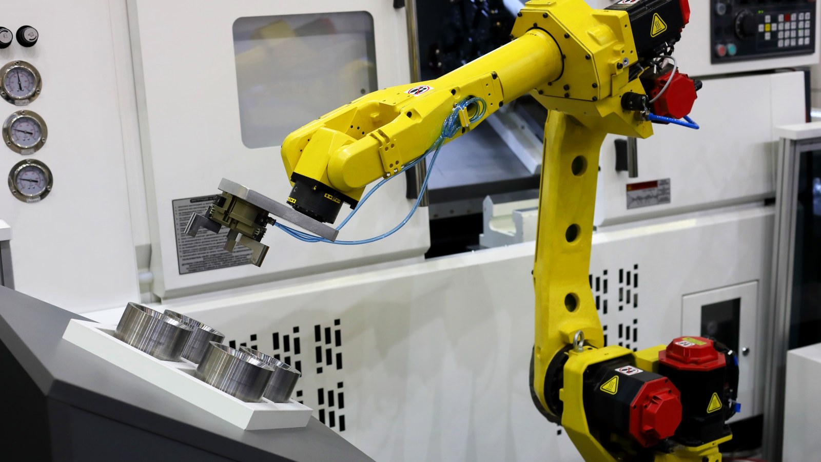 Industrial robot tending a CNC machine