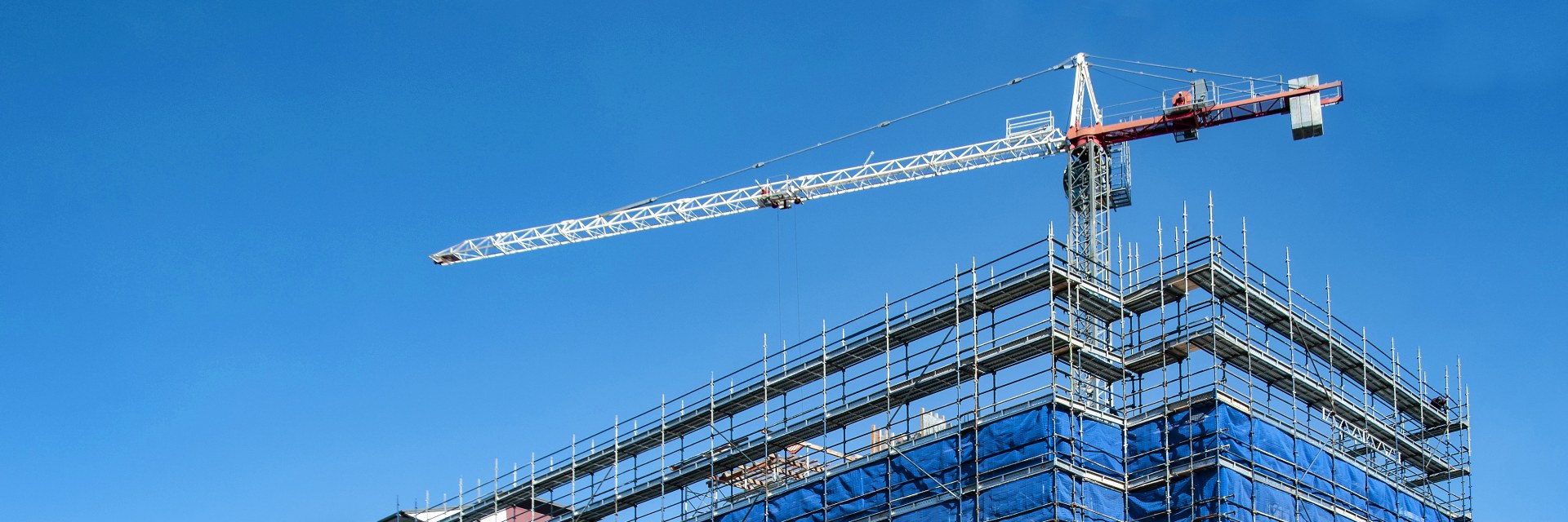 Tower crane over a building under construction