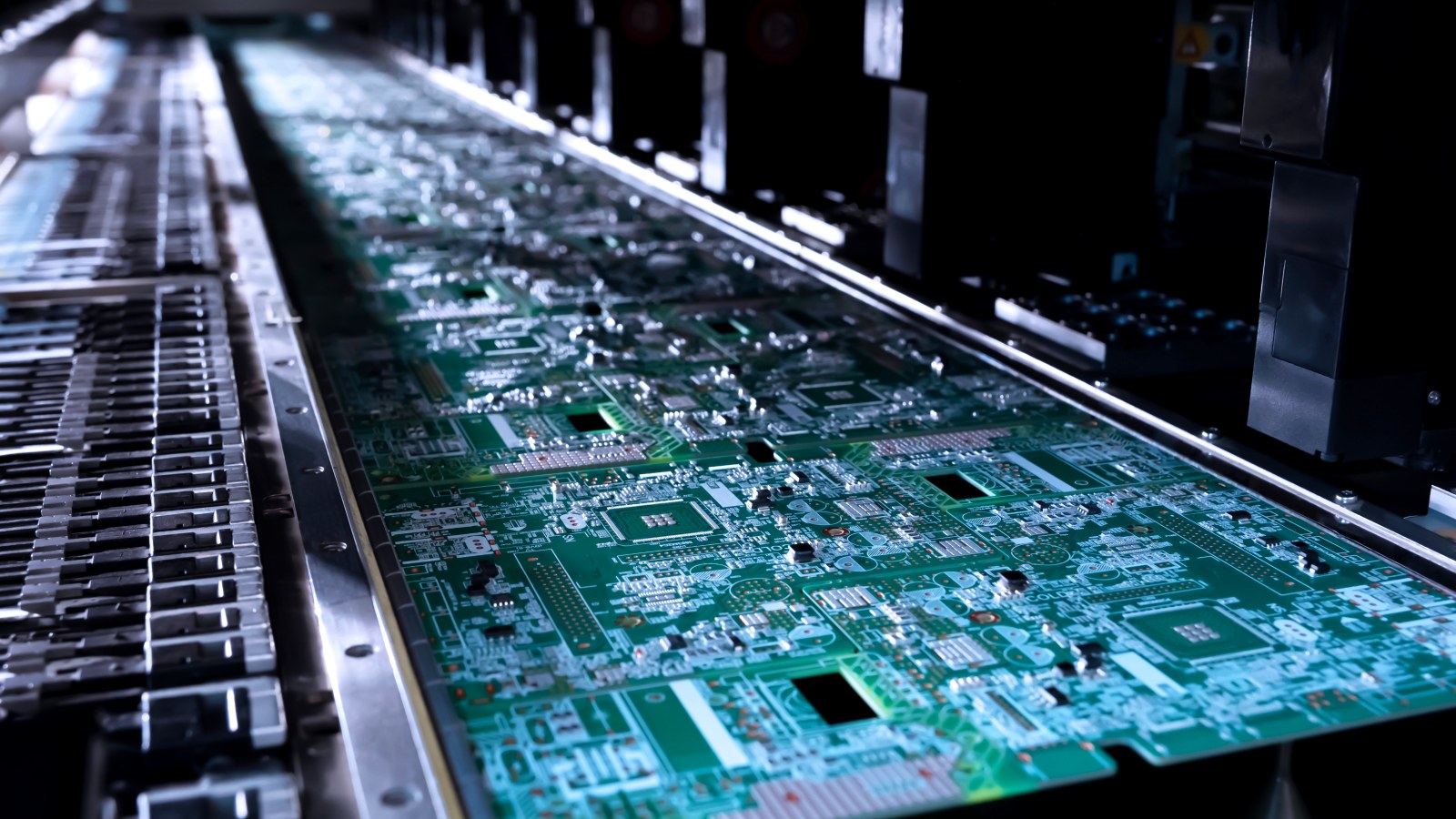 Circuit boards moving through an electronics assembly line