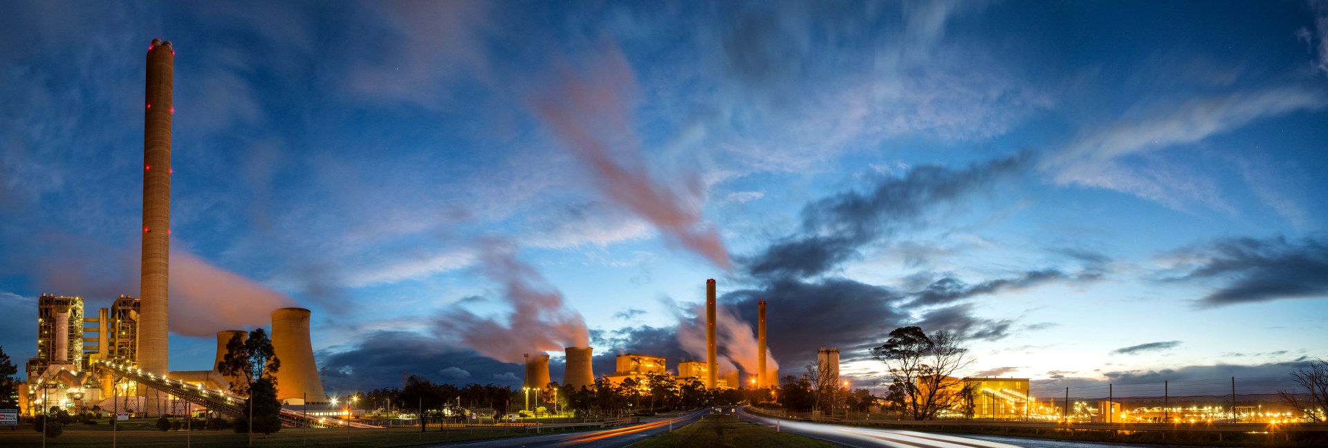 Power station at dusk — generation plant and cooling towers