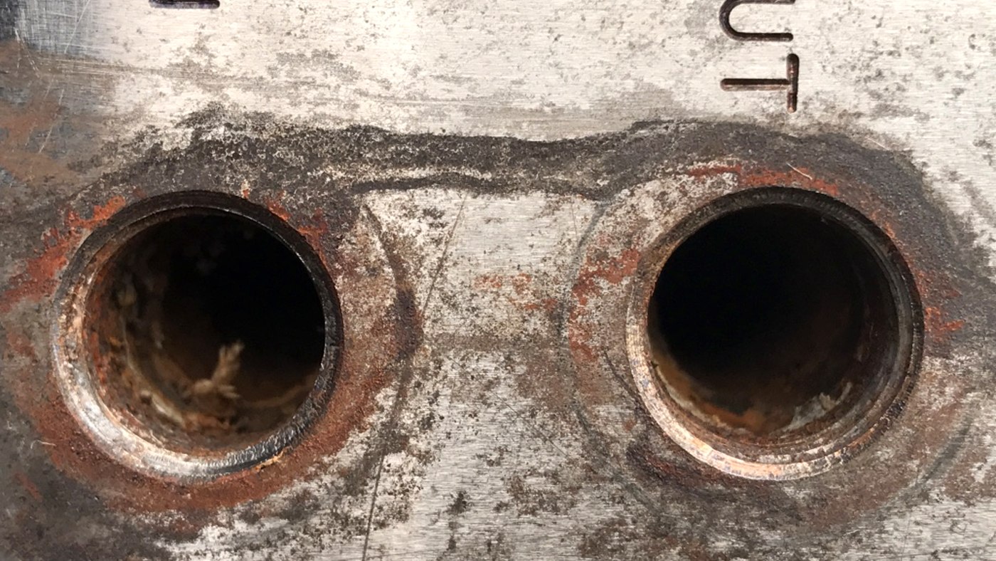 Corroded and scaled mould cooling ports before cleaning