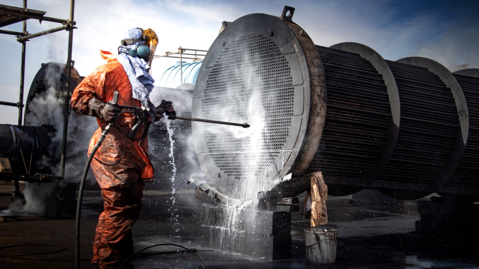 Shell-and-tube exchanger bundle being water-lanced by hand
