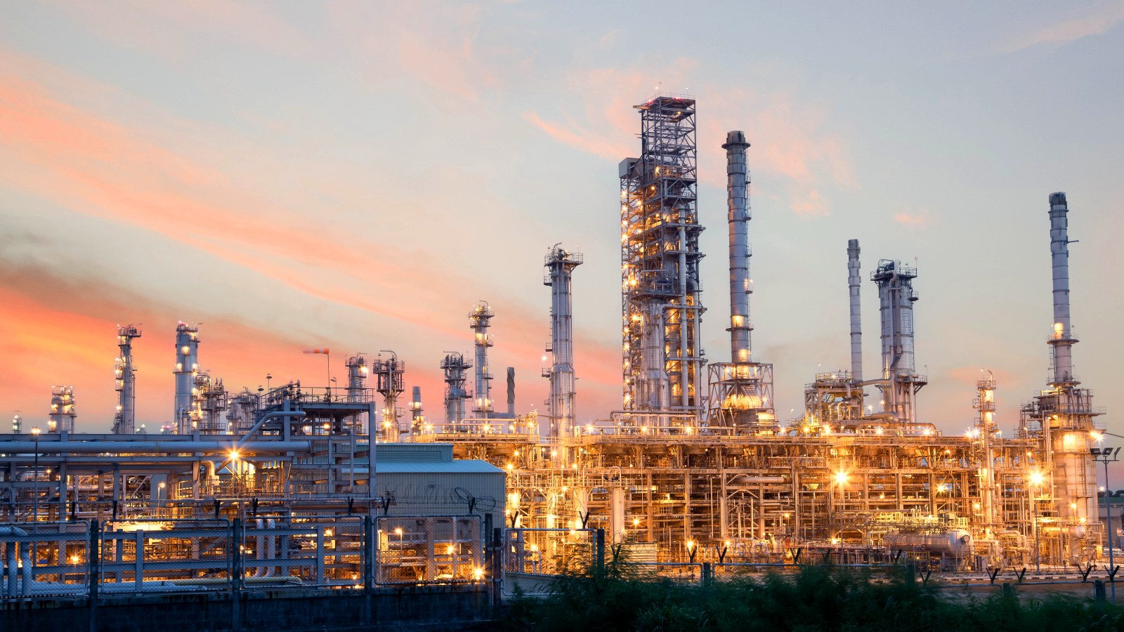 Petrochemical processing plant at dusk