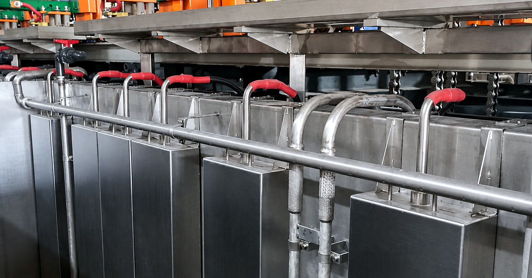 Immersible transducer boxes fitted around the existing pipework of a plating line