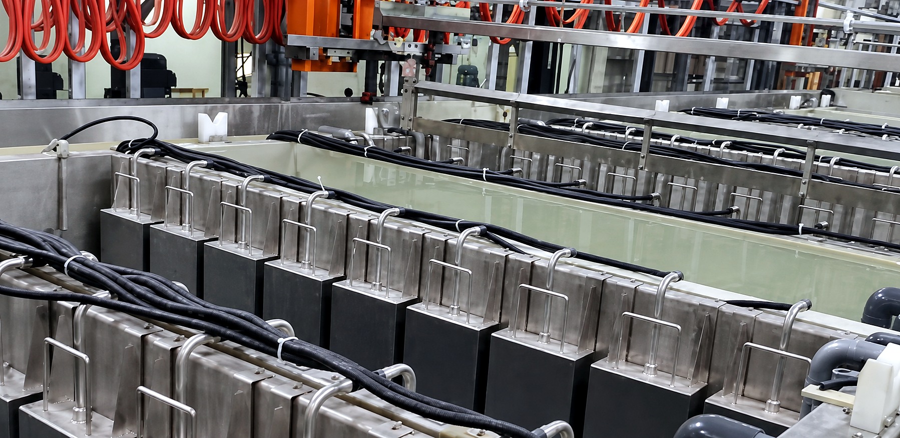 A working plating line retrofitted with immersible ultrasonic transducer boxes