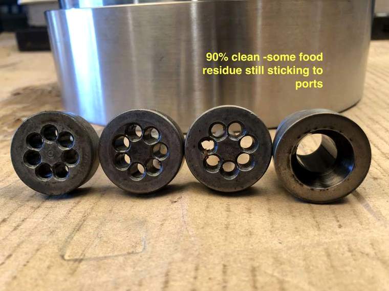 Row of dies labelled ninety percent clean with some residue still in ports