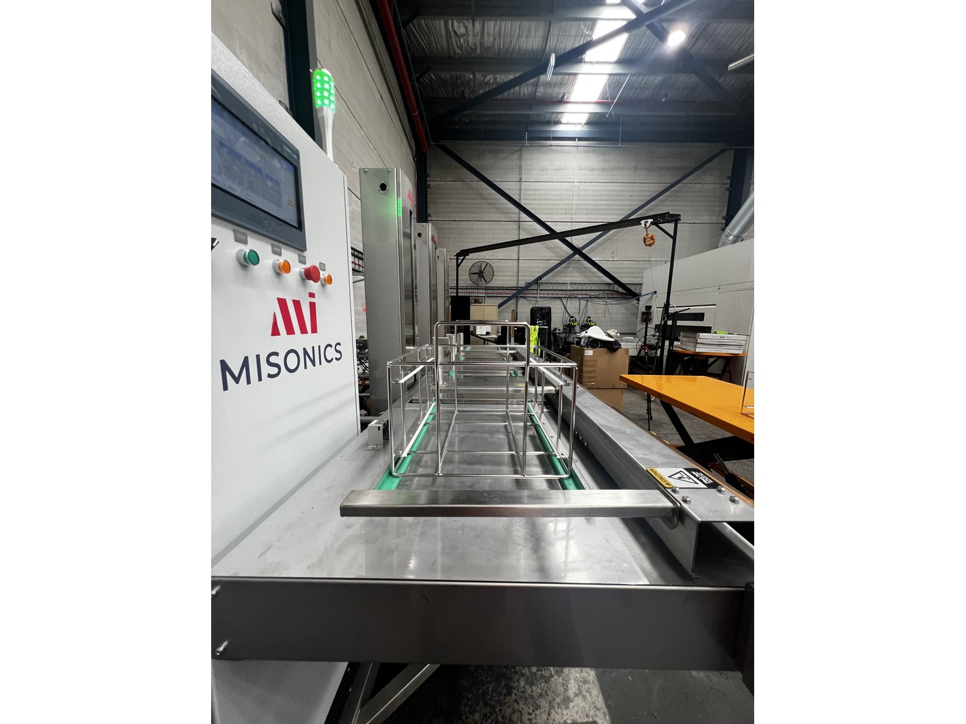 Looking along the stations of a Misonics Sonos L-130 three-stage ultrasonic cleaning line