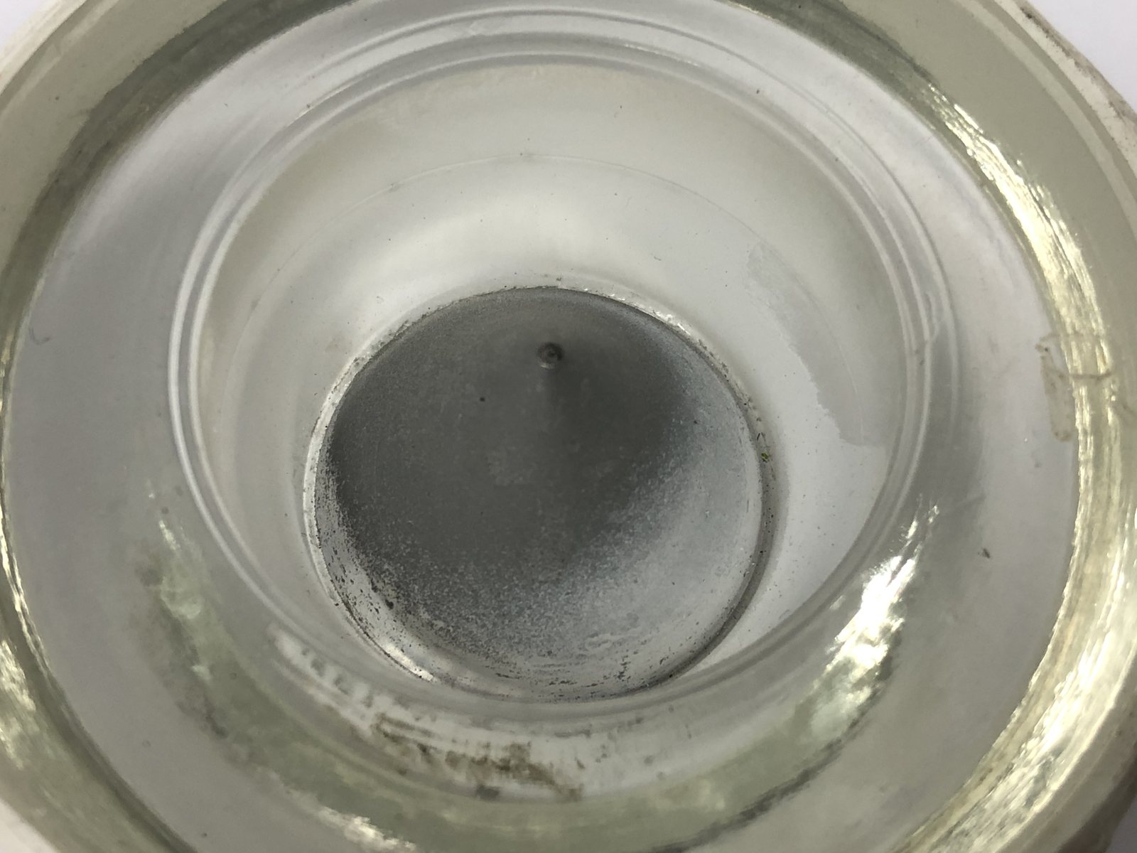 Airfield light lens centre optic before and after ultrasonic cleaning — as received