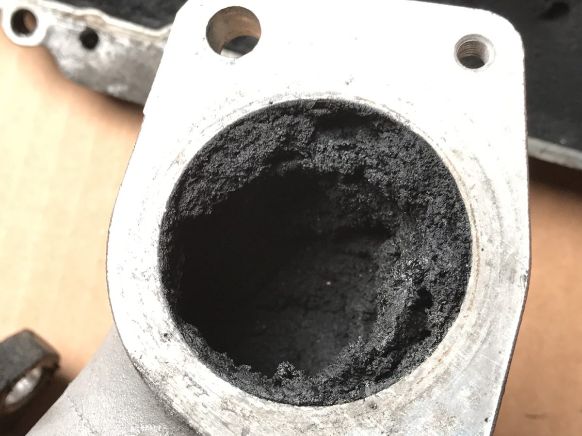 Inlet port bore — before and after ultrasonic cleaning — as received