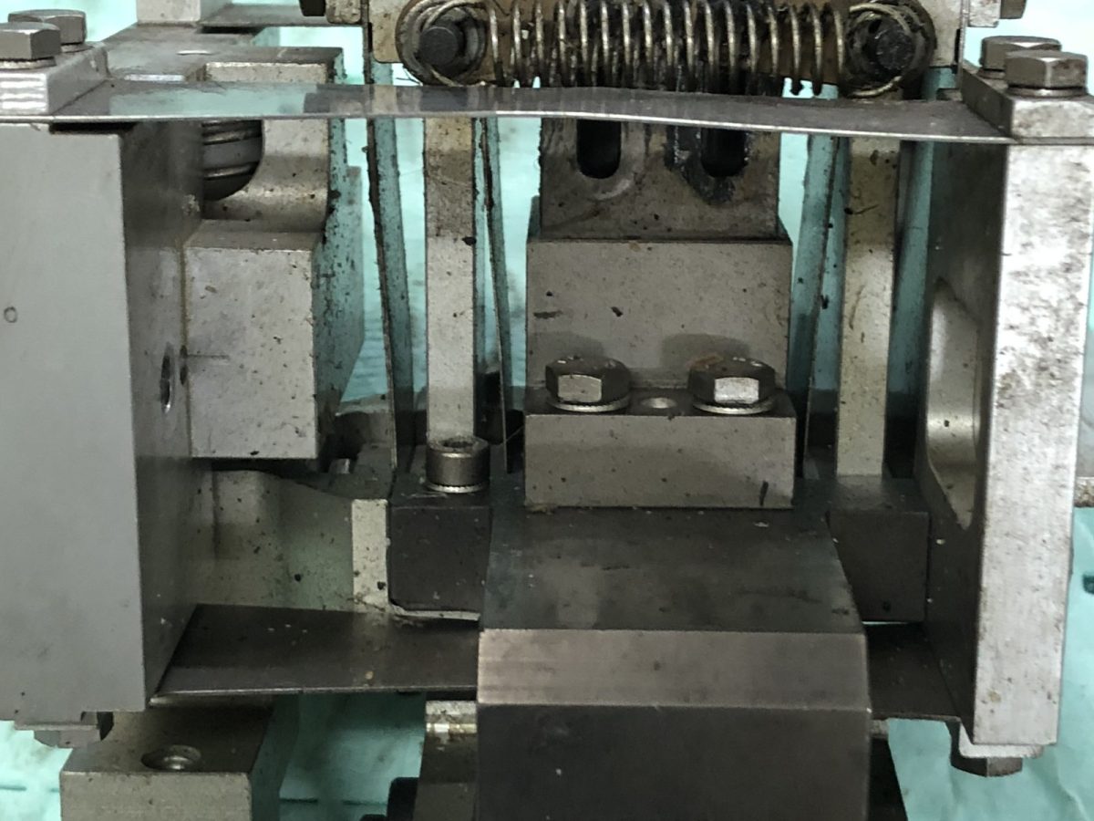 Knitting machine cam module packed with lint, wax and oil