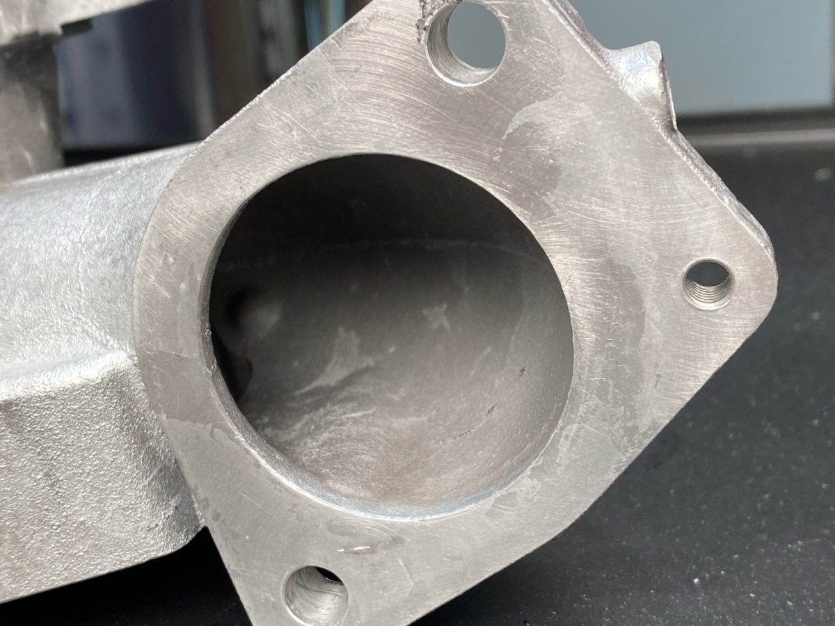 Manifold flange port — before and after ultrasonic cleaning — after the cycle