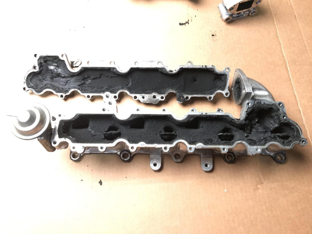 A pair of manifolds, as received — before and after ultrasonic cleaning — as received