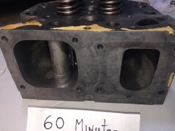 Cat 3516 cylinder head ports before and after ultrasonic cleaning &mdash; after the cycle