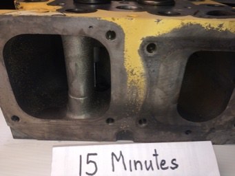 Cat 3516 cylinder head ports before and after ultrasonic cleaning &mdash; as received