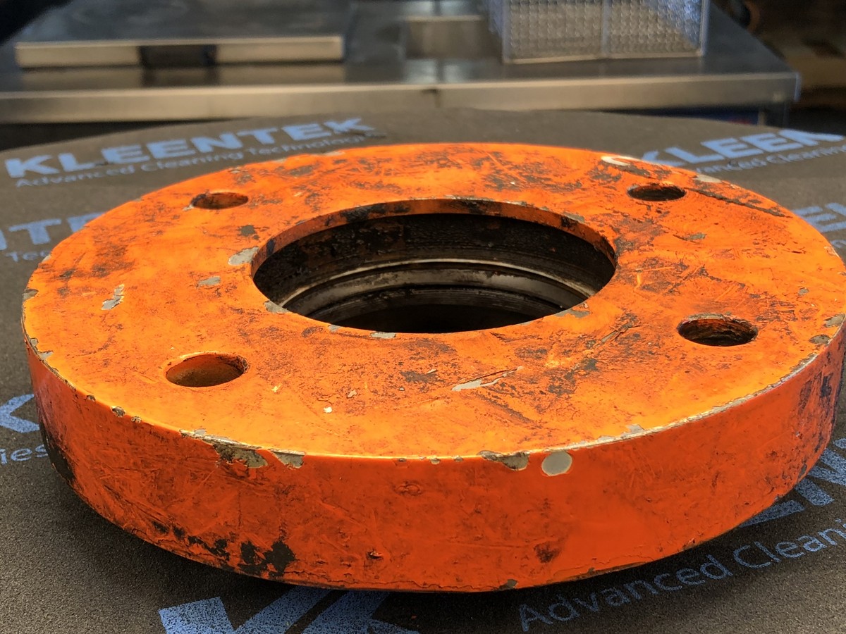 Painted flange plate — before and after ultrasonic cleaning — as received