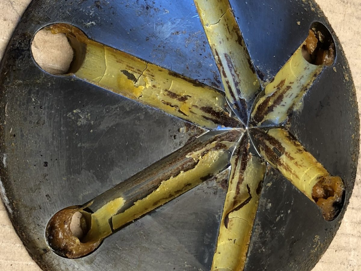 Slotted die cone — before and after ultrasonic cleaning — as received