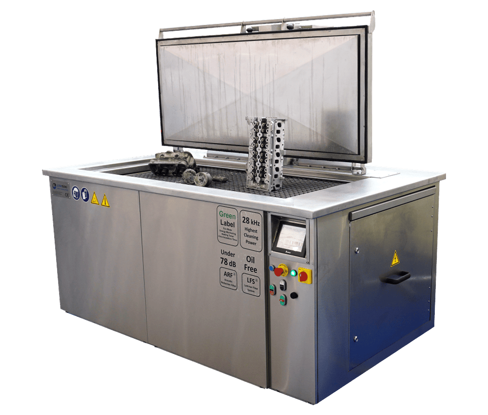 UltraTecno ACM-750N ultrasonic cleaning machine with the insulated lid open and a cylinder block standing on the platform lift