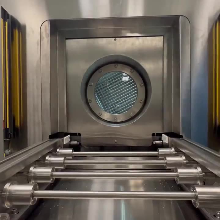 Clip: the chamber door swinging open at the conveyor